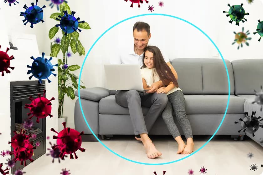 Family relaxing in living room using air purifier for allergies and home air quality testing.