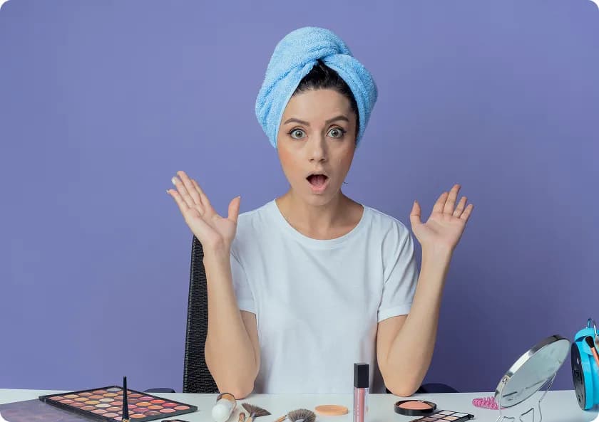 Woman applying moisturizer as part of a daily skin care routine