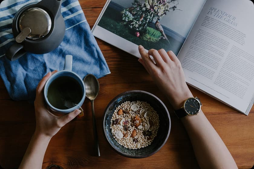 A vibrant morning scene showcasing a healthy morning routine with exercise, meditation, and a nutritious breakfast in a bright, modern setting.