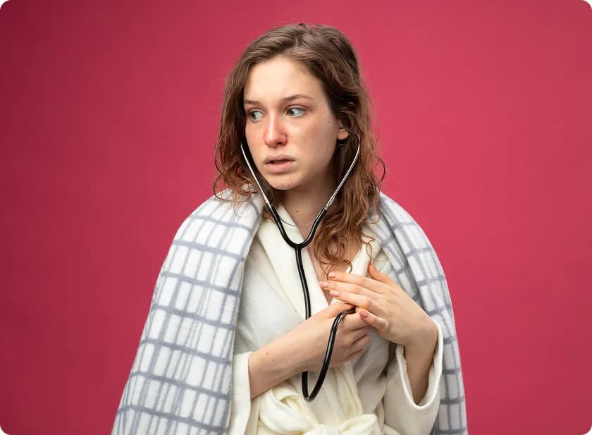 A worried woman holding a stethoscope to check for signs of heart failure in women.
