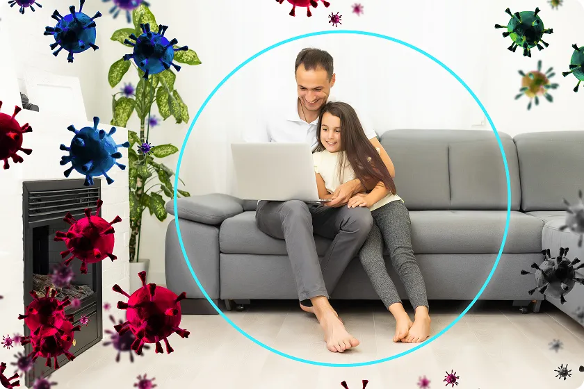 Family relaxing in living room using air purifier for allergies and home air quality testing.