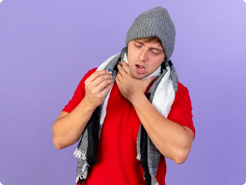 Man experiencing allergy attack with throat allergy symptoms, holding neck in pain
