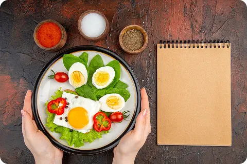 Eggs and greens plate showing foods that are low carb high fat