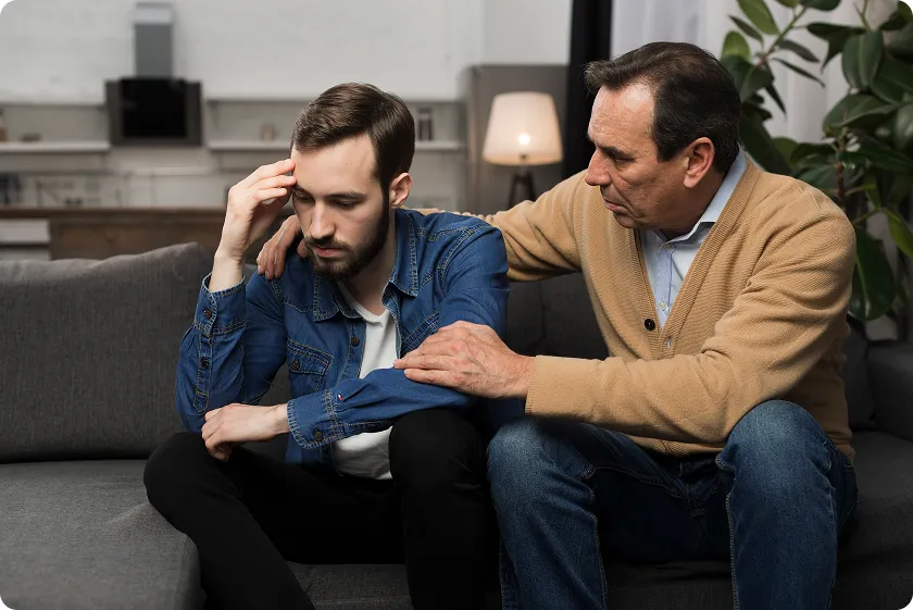 Person sitting away from hobbies, reflecting on signs your depressed and emotional withdrawal symptoms.