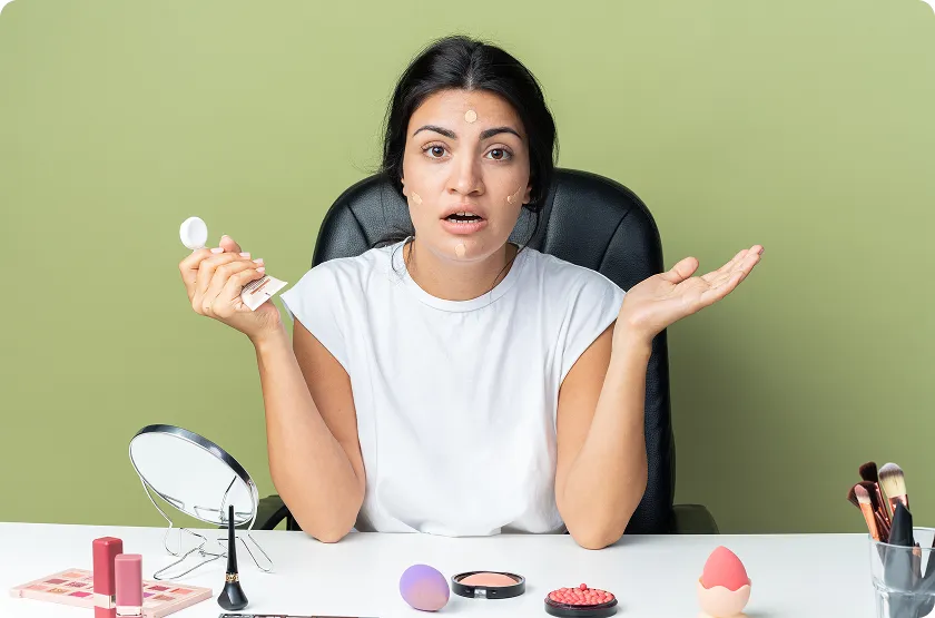 Woman checks her complexion while avoiding habits that damage skin