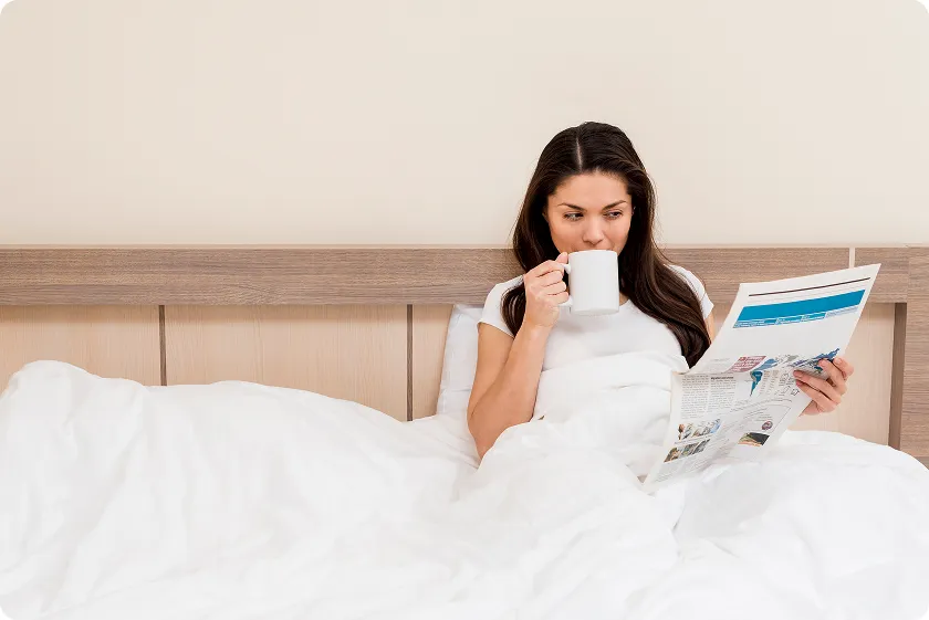 Calm person practicing breathing techniques from sleep hygiene checklist at bedtime.